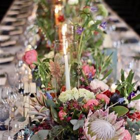 fwthumbLong table decoration The Fairmont Windsor Park, colourful wedding with protea, pineapples, roses, peonies.jpg